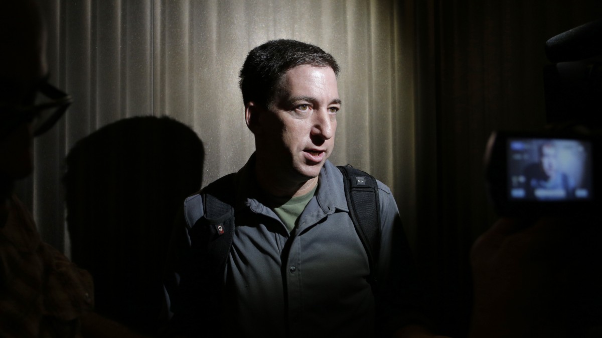 Glenn Greenwald speaks to reporters at his hotel in Hong Kong Monday, June 10, 2013. (AP Photo/Vincent Yu)