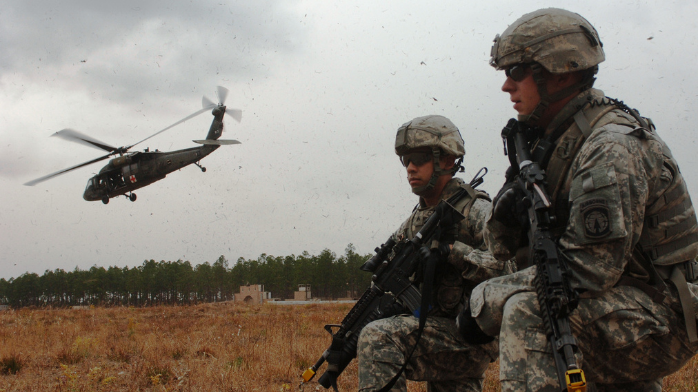 Two military policemen in Fort Bragg, North Carolina, December 2010. Current active-duty U.S. service members are among those with opinions about the recent debate for a strike in Syria. (Photo/DVIDSHUB via Flickr)