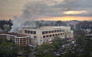 Dawn breaks over the still-smouldering Westgate Mall in Nairobi, Kenya Thursday, Sept. 26, 2013. Working near bodies crushed by rubble in a bullet-scarred, scorched mall, FBI agents began fingerprint, DNA and ballistic analysis Wednesday to help determine the identities and nationalities of victims and al-Shabab gunmen who attacked the shopping center, killing more than 60 people. (AP Photo/Ben Curtis)