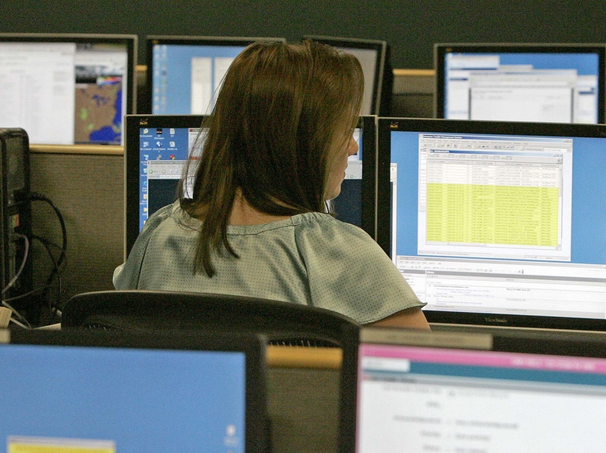 Verizon employees monitor activity in the Very Small Aperture Terminal Network Management Center
