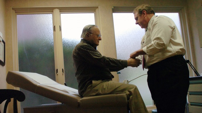 Dr. Winslow Murdoch, right, examines patient Joseph Balinski at his West Chester, Pa. office Wednesday, Nov. 16, 2005. Murdoch doesn't accept any insurance and instead has patients pay him a monthly retainer in an arrangement commonly referred to as a "concierge practice." The result, Murdoch and his patients say, is better, more hands-on care. (AP Photo/Bradley C. Bower)