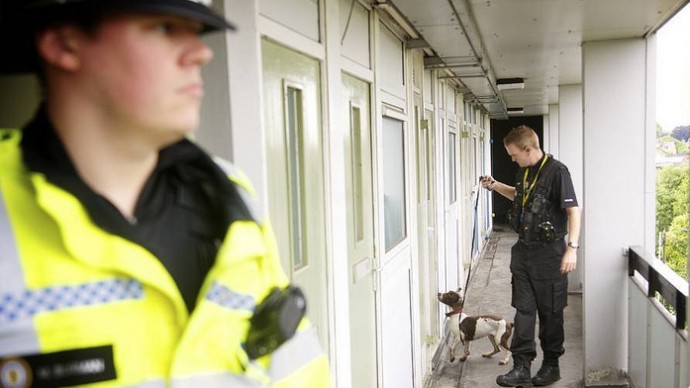Officers with a police sniffer dog. (Photo/West Midlands Police via Flickr)