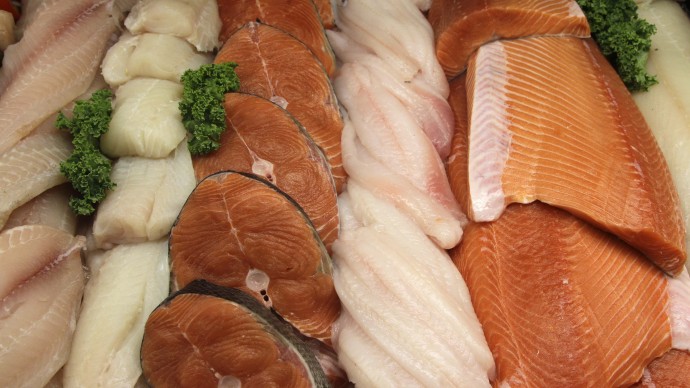 FILE - This Sept. 10, 2010, file photo, shows the seafood counter at Whole Foods Market in Hillsboro, Ore. Whole Foods Market says it will stop selling fish caught from depleted waters or through ecologically damaging methods, a move that comes as supermarkets nationwide try to make their seafood selections more sustainable. (AP Photo/Rick Bowmer, File)