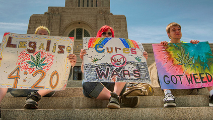 Marijuana legalization supporters with signs at a cannabis rally in Lincoln, Nebraska. (Photo/Jonathan Reyes via Flickr)