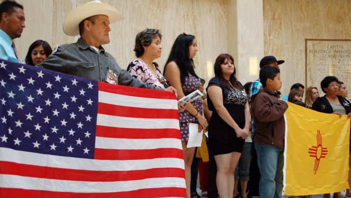 FILE - This Sept. 6, 2011 file photo shows protestors during a news conference organized by immigrant advocates at the Capitol in Santa Fe, N.M. As states pass various laws aimed at curbing illegal immigration and federal lawmakers balk at passing any immigration reforms, religious leaders from various denominations are jumping in the debate by holding rallies in front of statehouses. (AP Photo/Russell Contreras, File)