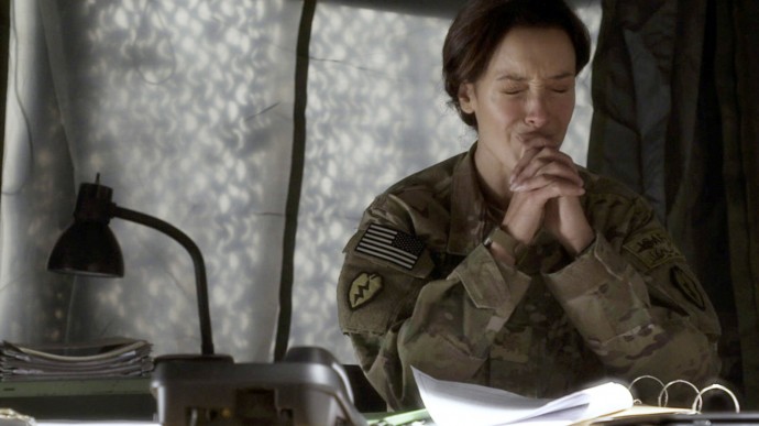 This image provided by WIGSCO, LLC shows Jennifer Beals, as Maj. Jo Stone in WIGS' "Lauren," reacting as she learns one of the soldiers under her command has reported being raped. The three-part Web series gives a close-up look at the challenges and obstacles women service members face in trying to find justice after being raped. (AP Photo/WIGSCO, LLC )