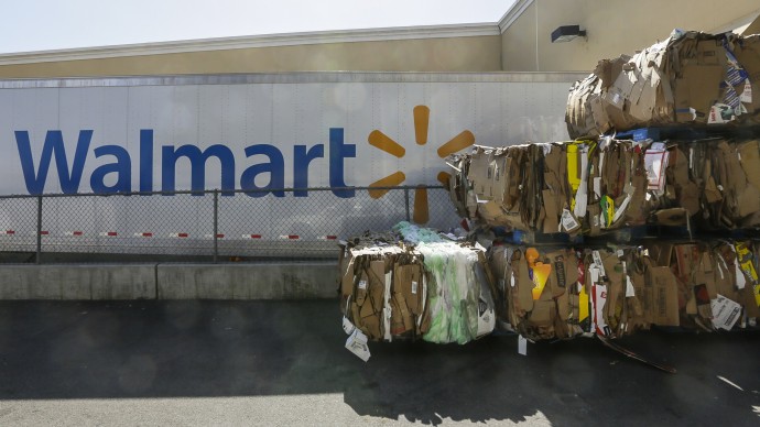 Recycled cardboard boxes are ready for transport outside a Walmart store in Duarte, Calif. Tuesday, May 28, 2013. Wal-Mart Stores Inc. pleaded guilty on Tuesday to charges the company dumped hazardous waste in Calif. Wal-Mart entered the plea in federal court in San Francisco to misdemeanor counts of negligently dumping pollutants from Walmart stores into sanitation drains across California, a company spokeswoman said. (AP Photo/Damian Dovarganes)
