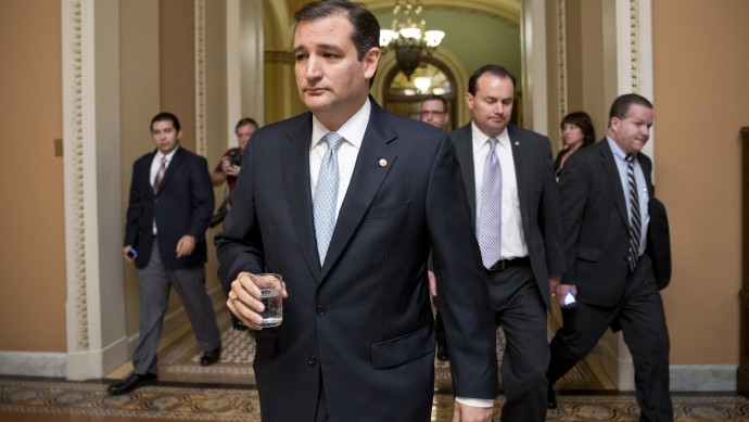 FILE - In this Wed., Oct. 16, 2013 file photo, Tea party conservatives Sen. Ted Cruz, R-Texas, and Sen. Mike Lee, R-Utah, right, walk to a meeting as the Senate prepares to vote on a measure to avert a threatened Treasury default and reopen the government after a partial, 16-day shutdown, at the Capitol in Washington. In May, U.S. Sen. Harry Reid, D-Nev., called Sen. Cruz, a “schoolyard bully."  Cruz responded: “The Senate is not a schoolyard setting.” He added: “Speaking the truth ... is not bullying.” (AP Photo/J. Scott Applewhite, File)