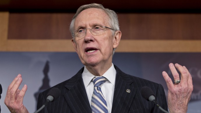 Senate Majority Leader Harry Reid, D-Nev., speaks with reporters after voting on a measure to avert a threatened Treasury default and reopen the government after a partial, 16-day shutdown, at the Capitol in Washington, Wednesday, Oct. 16, 2013. The bill moves next to the Republican-controlled House. The Senate vote permits the Treasury to borrow normally through Feb. 7 or perhaps a month longer, and fund the government through Jan. 15, 2014. (AP Photo/J. Scott Applewhite)