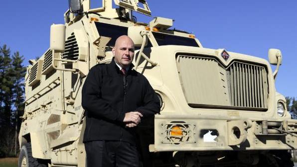 Warren County Under-sheriff Shawn Labouree stands next to the department's new mine resistance ambush protected vehicle, or MRAP in Queensbury, New York. (PhotoAP/Mike Groll)