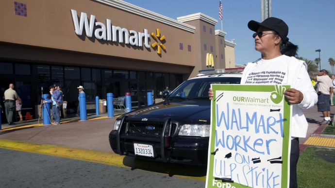 Angelita Rodriguez protests outside a Walmart store in Paramount, Calif., Friday Nov.23, 2012. Wal-Mart employees and union supporters are taking part in today's nationwide demonstration for better pay and benefits A union-backed group called OUR Walmart, which includes former and current workers, staged the demonstrations and walkouts at hundreds of stores on Black Friday, the day when retailers traditionally turn a profit for the year. ( AP Photo/Nick Ut)