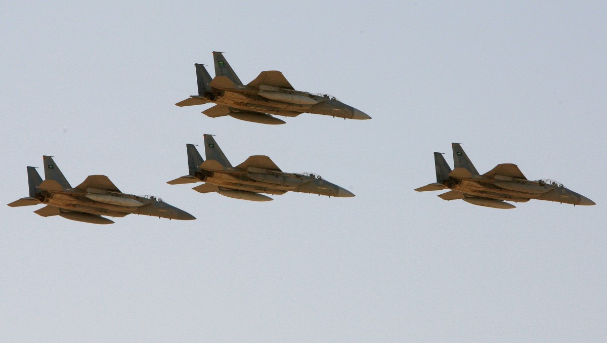 F-15 warplanes of the Saudi Air Force fly over the Saudi Arabian capital Riyadh during a graduation ceremony at King Faisal Air Force University. (AP/Hassan Ammar)