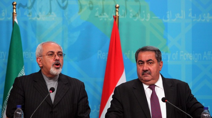 FILE - In this file photo taken Sunday, Sept. 8, 2013, Iranian Foreign Minister Mohammad Javed Zarif, left, speaks during a joint press conference with his Iraqi counterpart Hoshyar Zebari in Baghdad. The nuclear deal between Iran and six world powers could pave the way for normalization of ties between Tehran and the West. That prospect alarms Iran’s rivals, including Israel and Saudi Arabia, which argue Tehran is only being emboldened in its quest for regional dominance. (AP Photo/Ahmad Al-Rubaye, Pool, File)