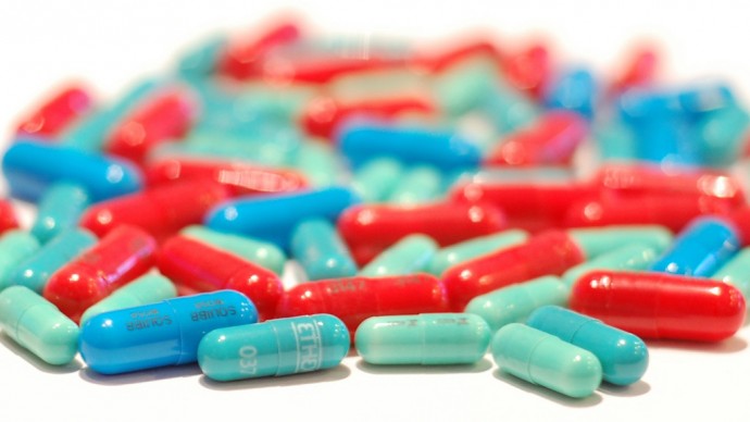 Pills are scattered across a clean surface in this Jan. 8, 2011 photo. (Photo by bradleypjohnson via Flikr)