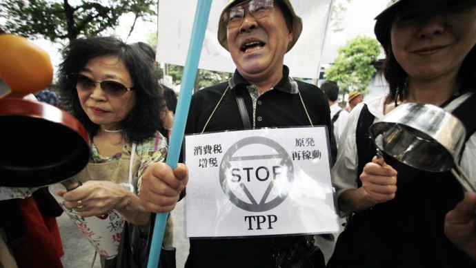 Demonstrators march with cookware during an anti-consumption tax hike, nuclear plant and TPP rally in Tokyo, Sunday, June 3, 2012.(AP Photo/Itsuo Inouye)