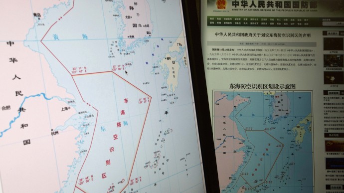 Computer screens display a map showing the outline of China's new air defense zone in the East China seen on the website of the Chinese Ministry of Defense in Beijing, China, Tuesday, Nov. 26, 2013. Beijing on Saturday, Nov. 23, 2013 issued a map of the zone _ which includes a cluster of islands controlled by Japan but also claimed by China _ and a set of rules that say all aircraft entering the area must notify Chinese authorities and are subject to emergency military measures if they do not identify themselves or obey Beijing's orders. (AP Photo/Ng Han Guan)
