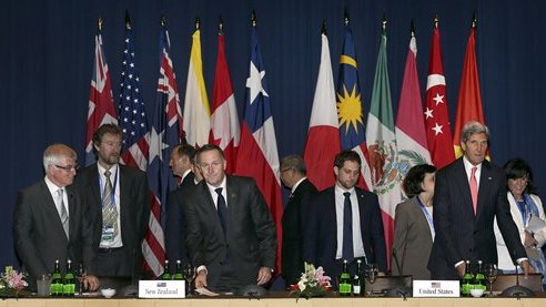 FILE - In this Oct. 8, 2013, file photo, U.S. Secretary of State John Kerry, front right, and New Zealand Prime Minister John Key, front second left, arrive for the Trans-Pacific Partnership meet in Bali, Indonesia. The failure to finalize a landmark trans-Pacific trade pact this year as planned has dealt a blow to President Barack Obama's policy pivot to Asia. While negotiators say they have made substantial progress, myriad hurdles remain to creating a bloc encompassing a third of global trade. One of the biggest will be winning the backing of the U.S. Congress. (AP Photo/Wong Maye-E, File)