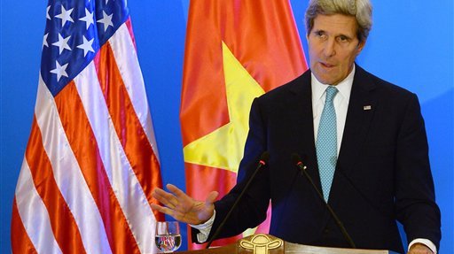 U.S. State Secretary John Kerry speaks during a joint press conference with Vietnamese Foreign Minister Pham Binh Minh in Hanoi Monday, Dec. 16, 2013. The United States will boost maritime security assistance to China's smaller neighbors amid rising tensions over disputed territories in the South China Sea, Kerry announced on Monday during a visit to Vietnam, where he also pressed the communist government on human rights and democratic and economic reforms. (AP Photo/Hoang Dinh Nam, Pool)
