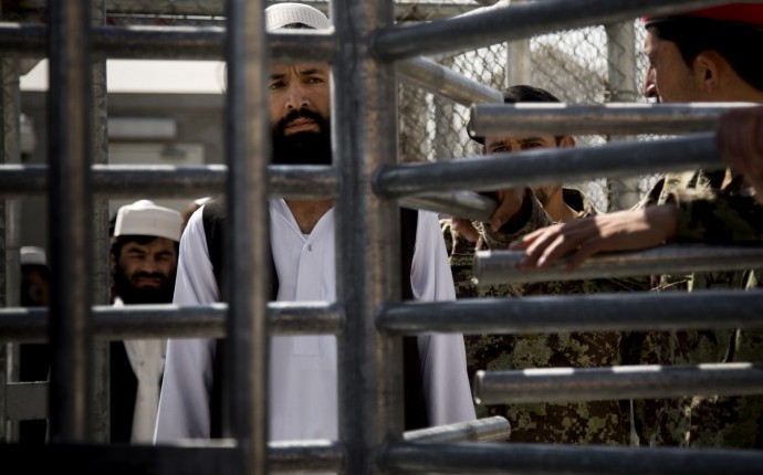 An Afghan prisoner waits in line for his release from Parwan Detention Facility after the U.S. military gave control of its last detention facility to Afghan authorities in Bagram, outside Kabul, Afghanistan, Monday, March 25, 2013. The handover of Parwan Detention Facility ends a bitter chapter in American relations with Afghanistan's mercurial president, Hamid Karzai, who demanded control of the prison as a matter of national sovereignty. (AP Photo/Anja Niedringhaus)