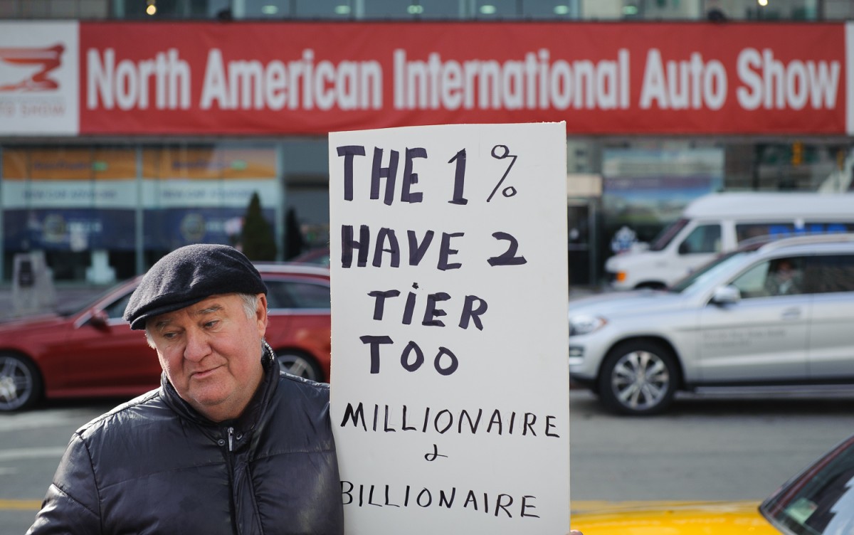 Mark Farris worked for Ford for 30 years. He turned out to voice his opposition to what is happening in society and with workers. He says, "The rich keep getting richer and the poor keep getting poorer."