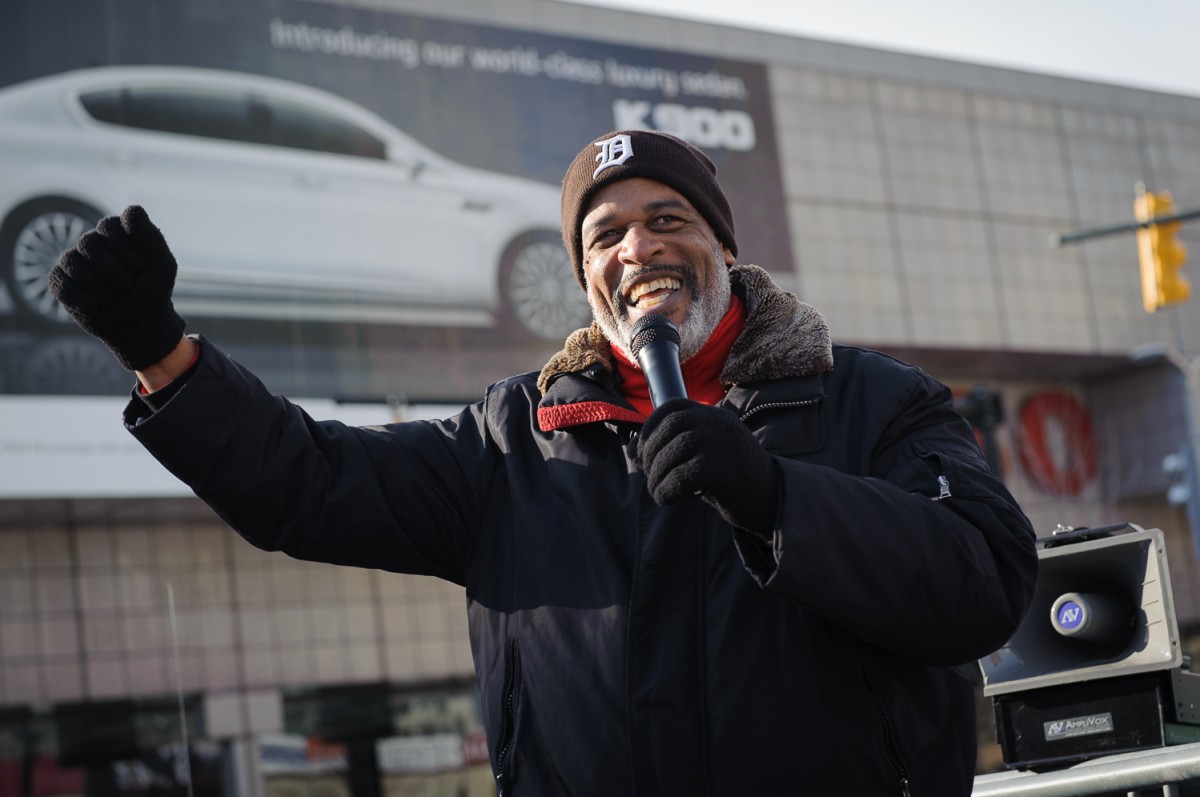 Melvin Thompson, former president of UAW local 140, and Warren Truck Assembly Plant worker of 19 years, rallies the crowd at the demonstration.