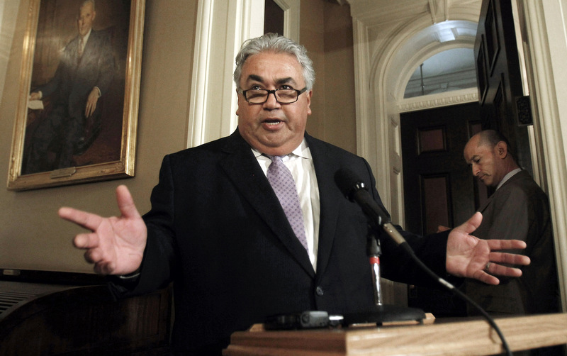Sen. Ron Calderon, D-Montebello, left, holds a brief news conference during first appearance at the Capitol since the FBI investigators raided his offices in Sacramento, Calif. (AP Photo/Rich Pedroncelli, File)