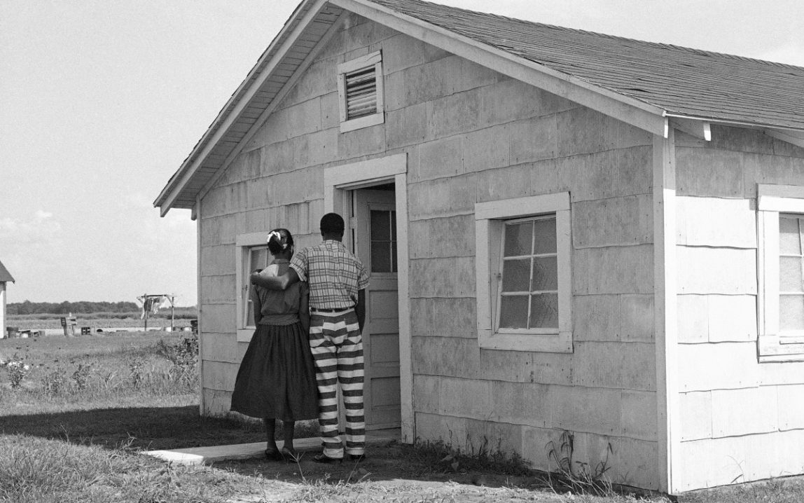 With his arm around his wife's shoulders, this prisoners at Mississippi's State Penitentiary at Parchman prepares to spend afternoon in privacy, Sept. 9, 1959. The house they are entering is one of the special ones built at the prison for such conjugal visits. As a result of this practice, Parchman has escaped the unrest which has been exploding in prisons elsewhere across the country. Parchman is perhaps the only American prison where this is done. (AP Photo)