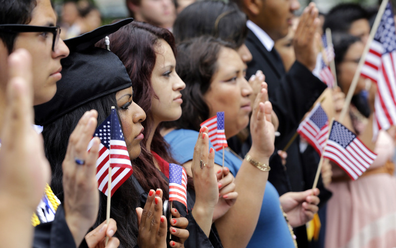 DREAMers (Development, Relief, and Education for Alien Minors) and parents take an oath in a mock citizenship ceremony during a "United we Dream," rally on Capitol Hill in Washington, Wednesday, July 10, 2013, sending a signal to the House of Representatives’ GOP leadership as they go into their meeting that afternoon to discuss immigration reform with their caucus. (AP Photo/Alex Brandon)