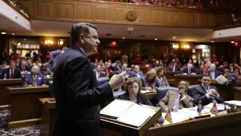 Peter Rusthoven, former associate counsel to President Ronald Reagan and an Indianapolis attorney, speaks in opposition to a measure on amending the state's constitution to ban gay marriage during a hearing of the House Judiciary Committee at the Statehouse in Indianapolis, Monday, Jan. 13, 2014. (AP Photo/Michael Conroy)