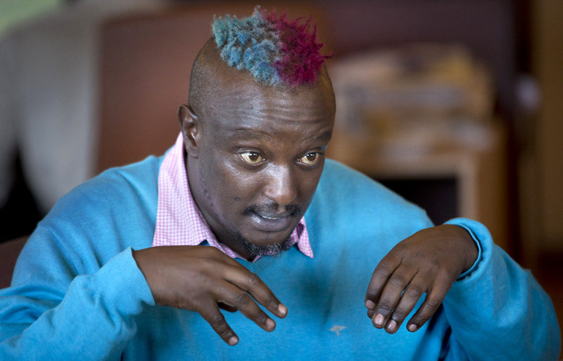 Prize-winning Kenyan author Binyavanga Wainaina talks during a television interview in Nairobi, Kenya Wednesday, Jan. 22, 2014. (AP Photo/Ben Curtis)