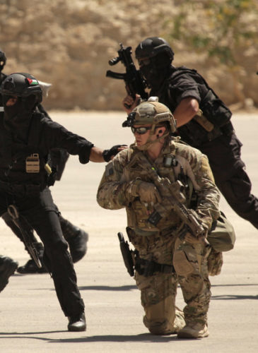 In this Thursday, June 20, 2013 photo, special operations forces from Iraq, Jordan and the U.S. conduct an exercise as part of Eager Lion multinational military maneuvers at the King Abdullah Special Operations Training Center (KASOTC) in Amman, Jordan. (AP Photo/Maya Alleruzzo)