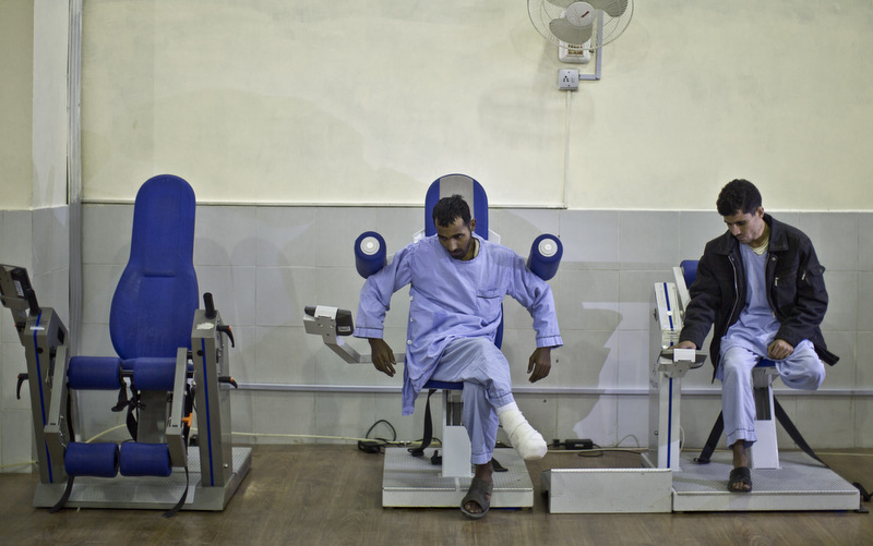 Pakistani soldiers, who were injured by improvised explosive devices planted by militants in Pakistan's tribal areas, exercise at the Armed Forces Institute for Rehabilitation Medicine in Rawalpindi, Pakistan. (AP Photo/Muhammed Muheisen)