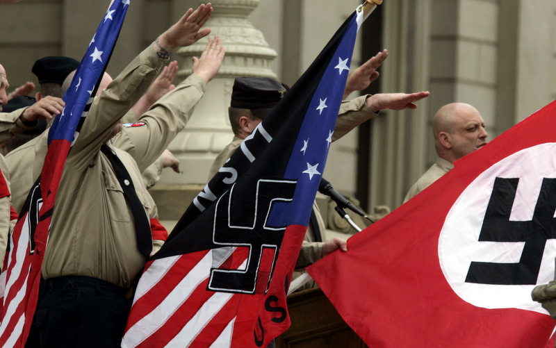 Members of the National Socialist Movement rally at the state Capitol in Lansing, Mich