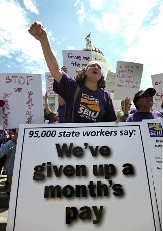 California state employee Diane Greagor joined hundreds of other state employees and supporters in a demonstration against proposed budget cuts to state employee pay, furloughs and other state services during a rally at the Capitol in Sacramento, Calif. (AP Photo/Rich Pedroncelli)