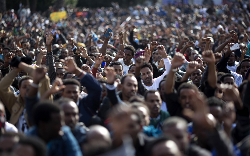 African migrants chant slogans during a protest in Rabin's square in Tel Aviv, Israel
