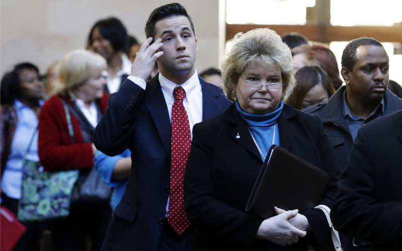 In this Wednesday, Jan. 22, 2014 photo, job seekers line up to meet prospective employers during a career fair at a hotel in Dallas. January was a second straight disappointing month for U.S. job seekers, though mainly in the government and retail sectors with the end of the holiday shopping season, according to the Labor Department, Friday, Feb. 7, 2014. (AP Photo/LM Otero)