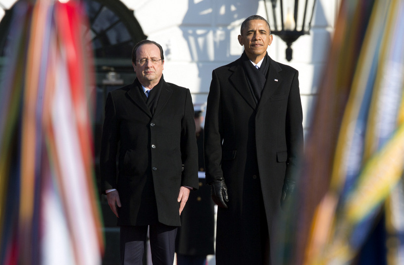President Barack Obama and French President François Hollande stand for the national anthem during a state arrival ceremony on the South Lawn of the White House in Washington, Tuesday, Feb. 11, 2014. Overshadowed by the intrigue of a European love triangle and a glamorous White House gala, Tuesday's policy talks between President Barack Obama and French President Francois Hollande will showcase a revamped relationship that is now a cornerstone of diplomatic efforts in Iran and Syria, as well as the fight against extremism in northern Africa. (AP Photo/ J. Scott Applewhite)