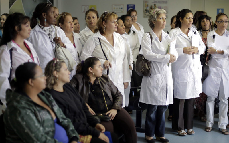 A group of Cuban doctors attend a training session at a health clinic in Brasilia, Brazil