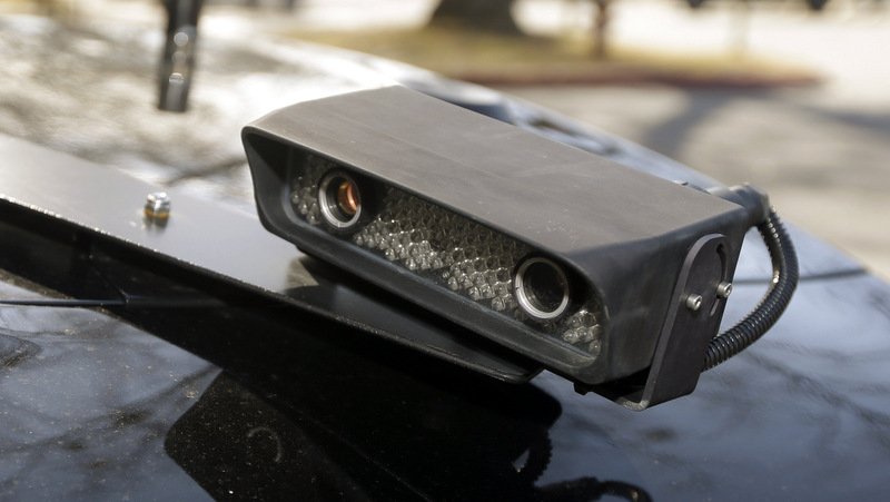 a camera is mounted near the rear window of a police car in Little Rock, Ark