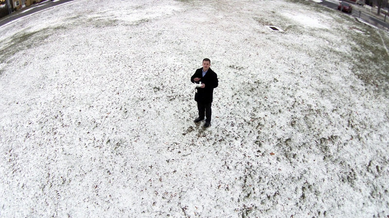 Journalist flying drone