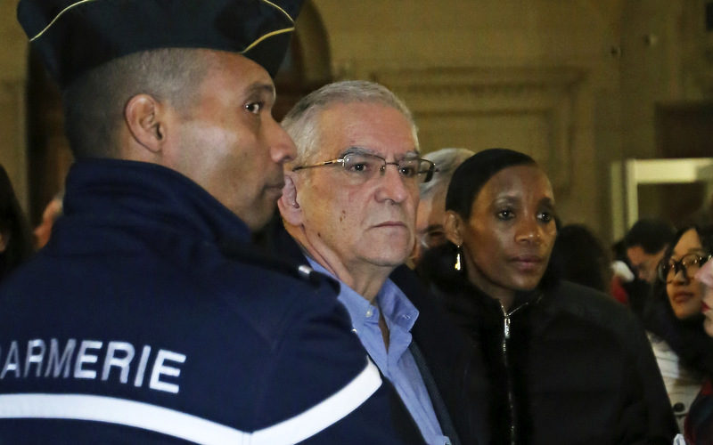 Alain Gauthier, center, a French school teacher and creator of the Collective of Civil Plaintiffs for Rwanda, and his wife Dafroza Gauthier, right, arrive at Paris law court for the trial of Pascal Simbikangwa, a 54-year-old former Hutu intelligence chief, who faces charges of complicity in genocide and complicity in war crimes, at Paris law court, Tuesday Feb. 4, 2014. He could face a life sentence if convicted after the seven-week trial. The case has highlighted criticism of France's own reaction to the genocide a generation ago, and its slow exercise of justice after the slaughter of at least 500,000 people over 100 days.(AP Photo/Remy de la Mauviniere)