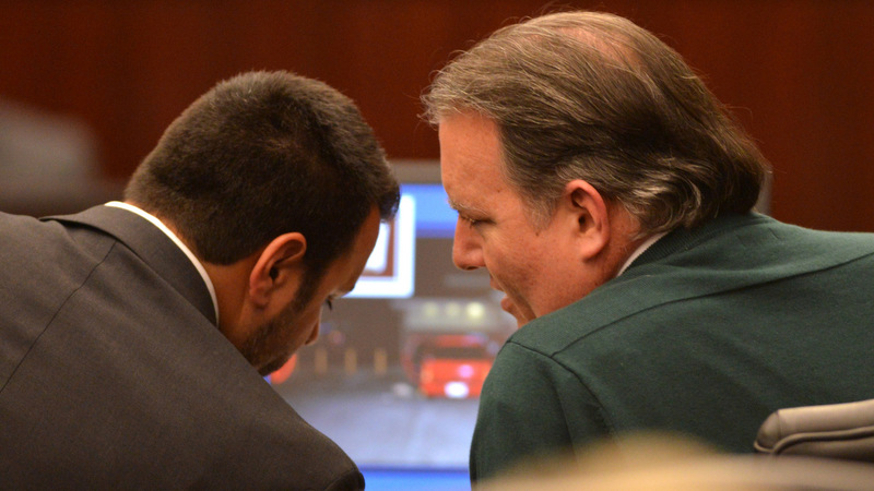 Defense attorney Cory Strolla, left, talks with Michael Dunn during the first day of Dunn's trial in Jacksonville, Fla., Thursday Feb. 6, 2014. Michael Dunn is charged in the shooting death of Jordan Davis who was outside a Jacksonville store with friends in November 2012. (AP Photo/Bob Mack, Pool)