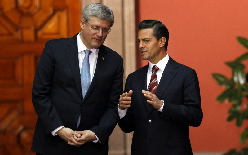 Mexico's President Enrique Pena Nieto, right, with Canada's Prime Minister Stephen Harper