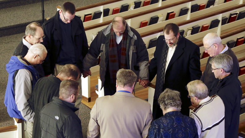 Religious leaders of various denominations in Fremont, Neb., pray at the First United Methodist Church, following a service, part of 40 Days of Prayer for Fremont. The prayer and meeting comes ahead of a special election Tuesday, Feb. 11, to decide whether to drop housing restrictions against illegal immigrants, as had been approved by Fremont voters in the 2010 elections. The city leaders scheduled the special election because of concerns the housing restrictions could cost them millions in federal grants and lead to more lawsuits against the city. (AP Photo/Nati Harnik)