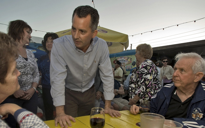 Florida Republican Congressional candidate David Jolly talking with supporters in Indian Rocks Beach, Fla. Need proof outside money is going to matter in this year’s elections? Just look at spending this week. Republicans are sending almost $2 million into a Florida special election for the U.S. House and Democrats are standing by with almost the same amount.  (AP Photo/Steve Nesius, File)