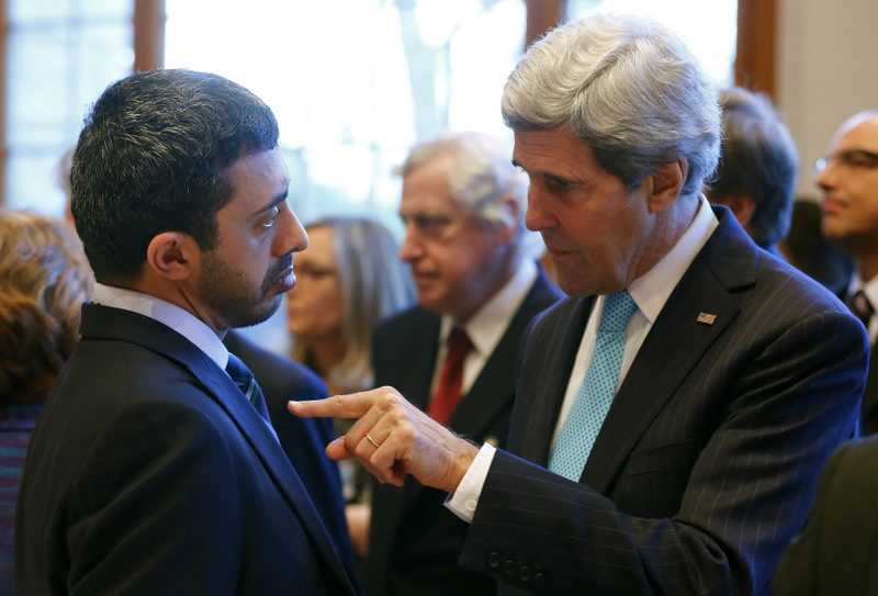 U.S. Secretary of State John Kerry, right, talks to United Arab Emirates Foreign Minister Abdullah bin Zayed Al Nahyan, left, prior to peace talks in Montreux, Switzerland, Wednesday, Jan. 22, 2014. (AP Photo,Arnd Wiegmann,Pool)