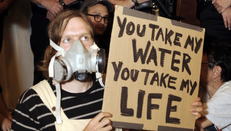 Environmental clean water protester John Nicholson participates in a protest outside Pennsylvania Gov. Tom Corbett's chambers following a rally in the state capitol against gas drilling in the Marcellus Shale natural gas formation Tuesday, June 7, 2011 in Harrisburg, Pa. (AP PHOTO/Bradley C. Bower)