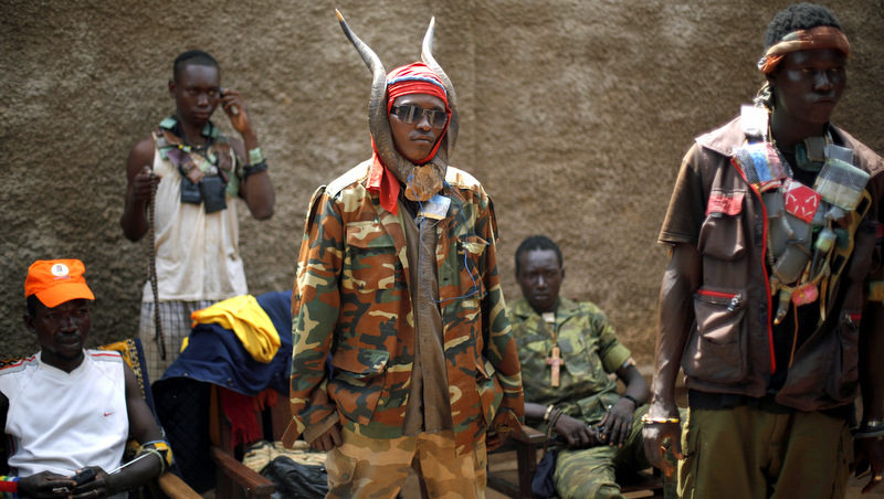 Anti-Balaka Christian militiamen stand in the Combatant district of Bangui, Central African Republic, Tuesday Feb. 4, 2014.