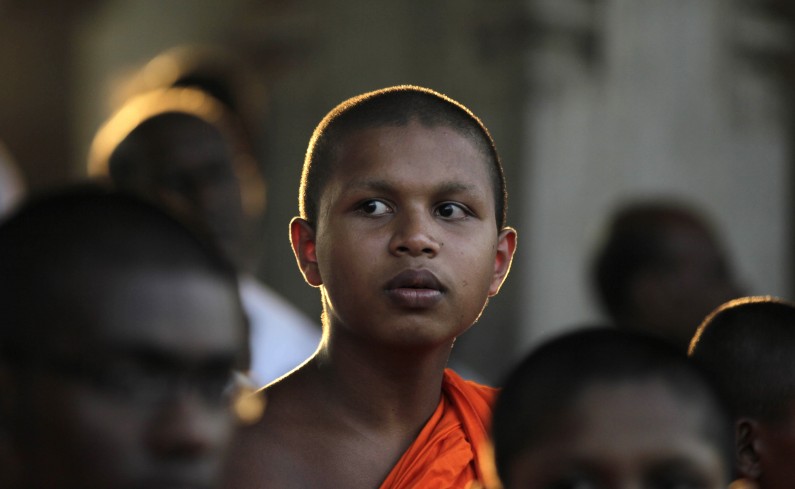 A Sri Lankan Buddhist monk participates in a vigil condemning a U.S. backed resolution against Sri Lanka on alleged war crimes at the U.N. Human Rights Council, in Colombo, Sri Lanka, Tuesday, March 25, 2014. The United Nations human rights body is expected this week to vote on a United-States sponsored resolution over Sri Lankas failure to investigate alleged war crimes in the final stages of the countrys decades-long civil war. (AP Photo/Eranga Jayawardena)