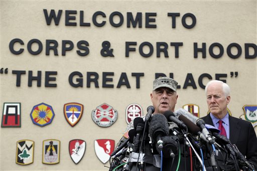 Lt. Gen. Mark Milley, left,and U.S. Sen. John Cornyn, right, talk to the media near Fort Hood's main gate, Thursday, April 3, 2014, in Fort Hood, Texas. A soldier opened fire Wednesday on fellow service members at the Fort Hood military base, killing three people and wounding 16 before committing suicide. (AP Photo/Eric Gay)